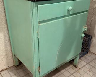 Vintage cabinet with metal enamel top
