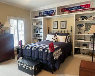 Wrought iron and brass queen sized bed with  nautical themed decor