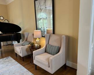 Beautiful neutral upholstered nailhead trim chairs (mirror not available for sale)