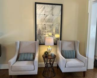 Beautiful neutral upholstered nailhead trim chairs (mirror not available for sale)