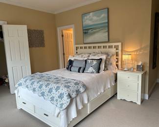 Queen sized white bed with four felt lined storage drawers