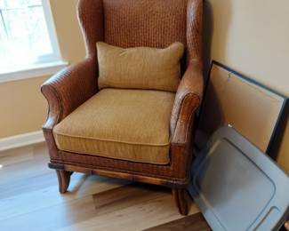 One of two matching wicker chairs