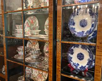 In the middle section of the cabinet is a beautiful porcelain Chinese dinner service approximately 60 pieces in the rose medallion pattern