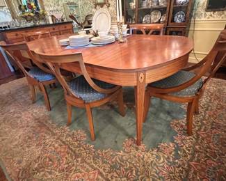Superb antique dining room table with string and medallion inlay includes extra leaf and six chairs