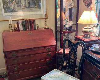 Slant front desk and another curio cabinet