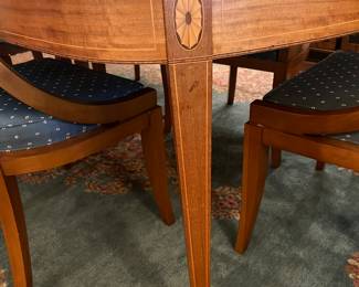 Superb antique dining room table with string and medallion inlay includes extra leaf and six chairs