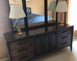 Dresser with triple hinged mirror