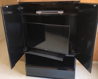 Tv in gloss laminate cabinet 
