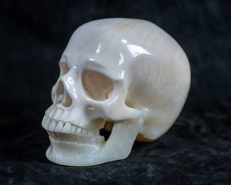 A crystal human skull carved out of White Onyx.
