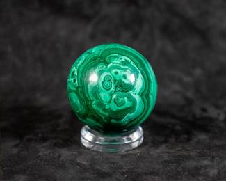 A Malachite Sphere, originating from Congo. Comes on a clear plastic base.
