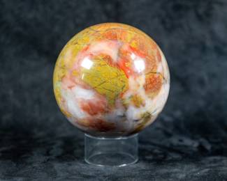 A sphere made of Ocean Jasper. Comes on a clear plastic stand.
