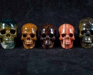 Five Skulls carved out of Jasper. One has a Quartz Crystal jaw. Dimensions of the largest skull included.
