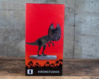 A 1/10 scale model of a Dilophosaurus from Jurassic Park, made by Iron studios. Still in the original box.
