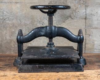 Large antique cast iron book press. Functions as it should.
