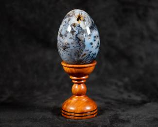 A carved Agate egg placed on a beautiful turned wood base made by artist Bryan Nelson.
