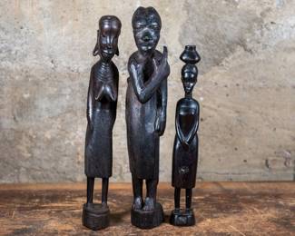 A set of three sculptures of African women carved out of Ebony wood. Largest sculpture dimensions are included.
