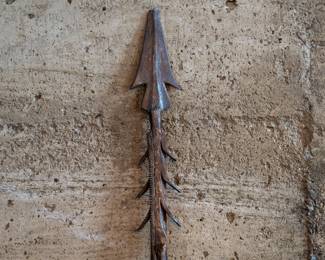 A Traditional African Fishing Spear. With an iron tip and rotating barbs. Tip has been chipped off.
