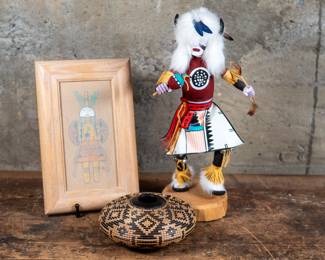 "Kachina" a Hopi sandpainting by artist Rosie Manuelito, "White Buffalo" a Anasazi wood sculpture made in 1992 by artist Sammie Walker, and a SouthWestern U.S. piece of turned wood art. "White Buffalo" dimensions are included.
