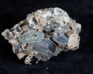 A large piece of Beryl Aquamarine mixed in a formation of Mica. Sourced from Haramosh, Gilgit, Pakistan. Comes with a label outlining the details of the piece.
