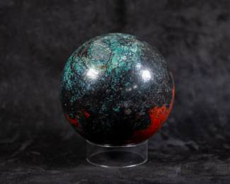 A large sphere made of polished Polychrome Jasper. Comes with a clear plastic stand.
