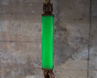 An art deco chartreuse glass floor lamp. The lamp is in working condition, however we would recommend the buyer attempt to re-wire the lamp.
