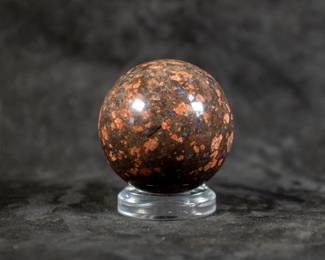 A sphere made of Leopard Skin Jasper. Comes on a clear plastic base.
