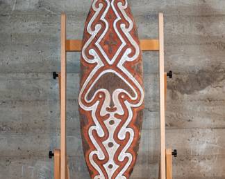 A Gope or "Spirit Board" from Papau New Guinea. In the area of the Papuan Gulf, these represent spirits that protect clans from sickness, malevolent spirits and death. There is a wire strung across the back so this piece can be hung on the wall.
