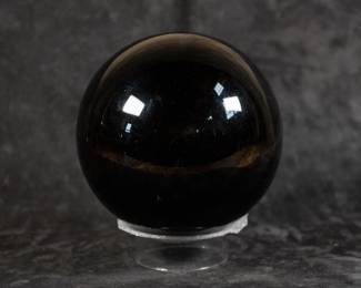 A large Black Obsidian Sphere, made from a single large piece of pure obsidian mined in Mexico. Comes with a certificate of authenticity from G.M.M., Inc.