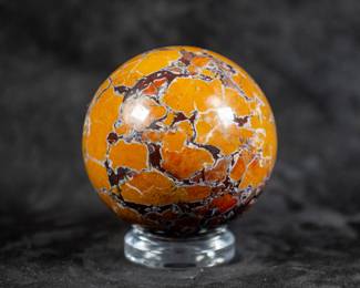A sphere made of Stone Canyon Jasper. Comes on a clear plastic stand.
