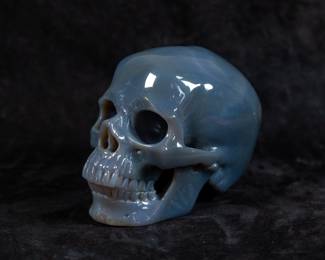 A Chalcedony carved human skull.
