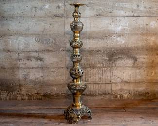 A tall brass candle holder of Middle Eastern design. In great condition.
