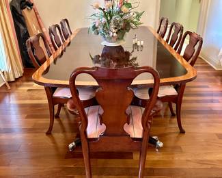 Table and 8 chairs available for immediate sale, $3,140 for the set, which also includes 2 20” leaves, leaf storage bags, custom pad set, and spare seat fabric. Set is by Georgian Furnishing Co LTD out of New Orleans.