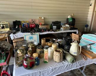 Lots of tools, candles, sewing machine, golf clubs in travel bag, hamper