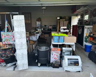 Purses, turkey fryer, large George Foreman, books, lots of music CDs, movie DVDs, cassettes, and VHS movies