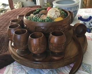 Wooden bowl with cups and ladle