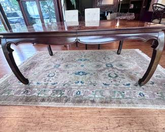Universal table with 2 leaves and pads. Has 2 matching captain’s chairs.