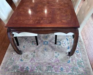 Universal table with 2 leaves and pads. Has 2 matching captain’s chairs.