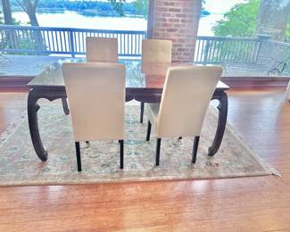 Universal table with 2 leaves and pads. Has 2 matching captain’s chairs.