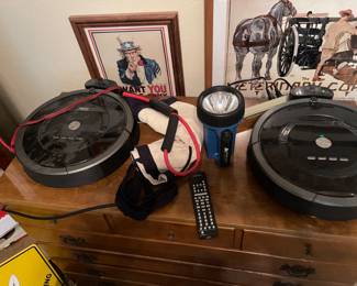 Two IRobot floor sweepers