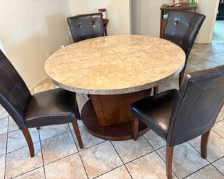 Heavy round dining table with four chairs 
