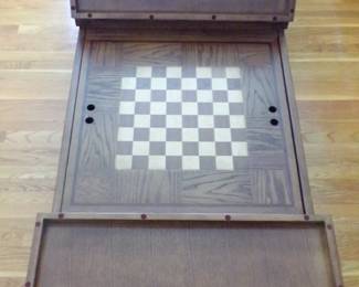 This is a very nice piece. It is an oak coffee table that folds out for a game table. Very well made.