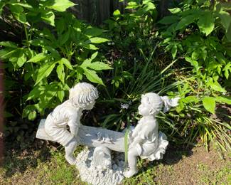 Boy/ girl on a seesaw yard art