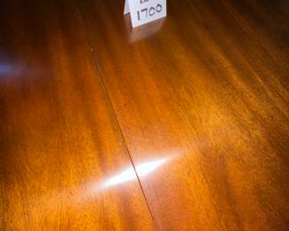 Kindel Winterthur Mahogany Dining table. 2 extension leaves, and table legs are on casters. Includes custom pads. Condition as shown.    68" x 46" plus 2- 12" leaves        