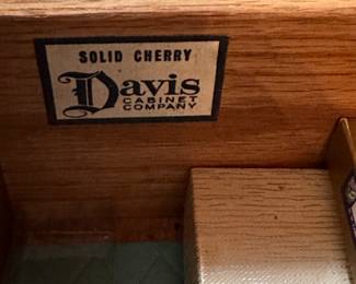 Pair of  Davis Cabinet Co. Solid Cherry cabinet with hutch. Hutch is lighted with glass shelves and brass double cross hatch on glass doors. We are selling separately (Waterford glassware has already been sold)