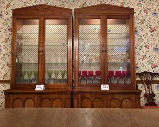 Pair of  Davis Cabinet Co. Solid Cherry cabinet with hutch. Hutch is lighted with glass shelves and brass double cross hatch on glass doors. We are selling separately (Waterford glassware has already been sold)