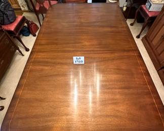 Kindel Winterthur Mahogany Dining table. 2 extension leaves, and table legs are on casters. Includes custom pads. Condition as shown.    68" x 46" plus 2- 12" leaves        