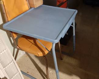 Adjust both height & slant of this table. Slides under a chair or bed