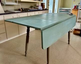 drop leaf table (harvest table), used here in her art room. It’s solid and sturdy!