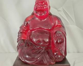 Red Acrylic Buddha Sculpture on Wood Stand
