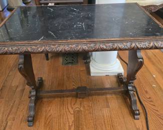 Marble top carved wood table
